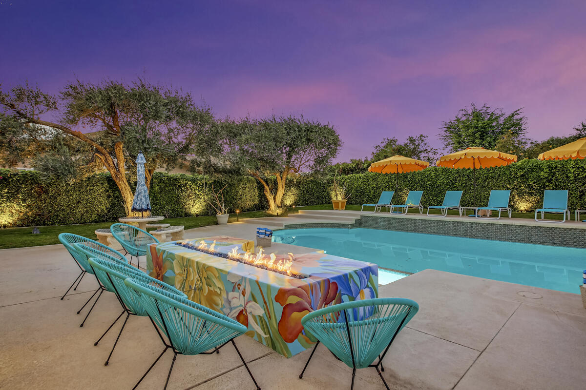 2230 Tamarisk Road Palm Springs, CA 92262 - Photo 16 of 66 a swimming pool with outdoor seating and yard