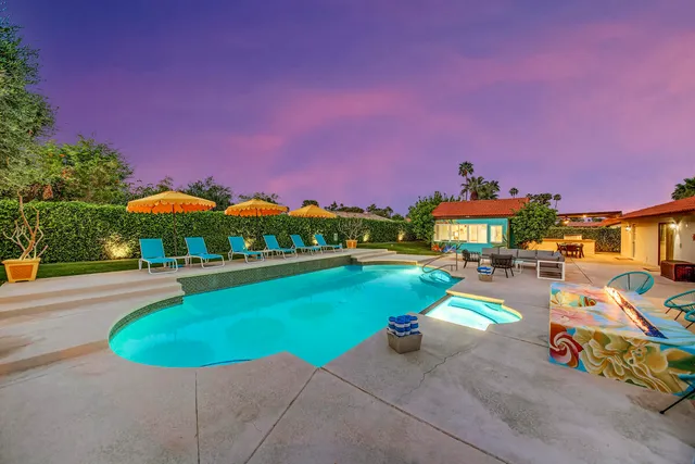 a bathroom with a granite countertop sink mirror and vanity