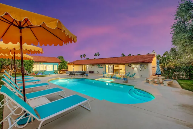 a room with furniture pool table and chair