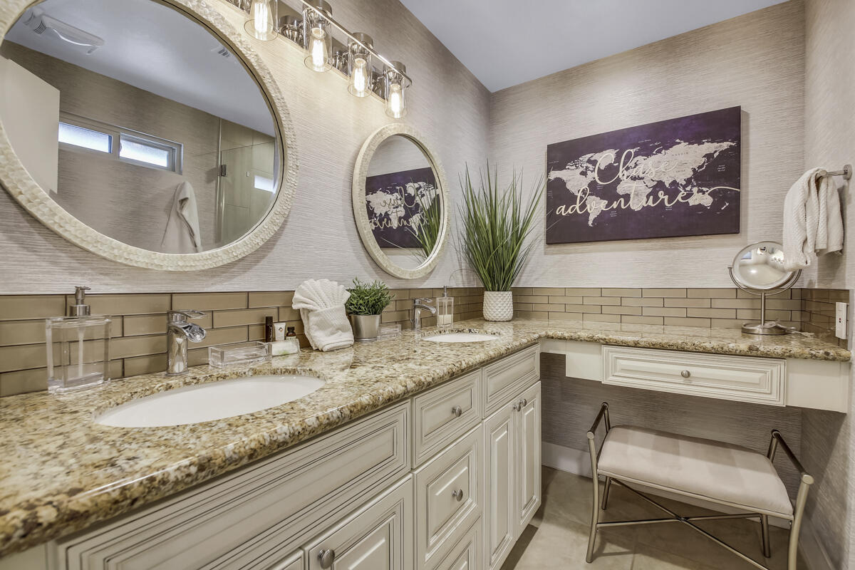 2230 Tamarisk Road Palm Springs, CA 92262 - Photo 50 of 66 a bathroom with a granite countertop double vanity and a mirror