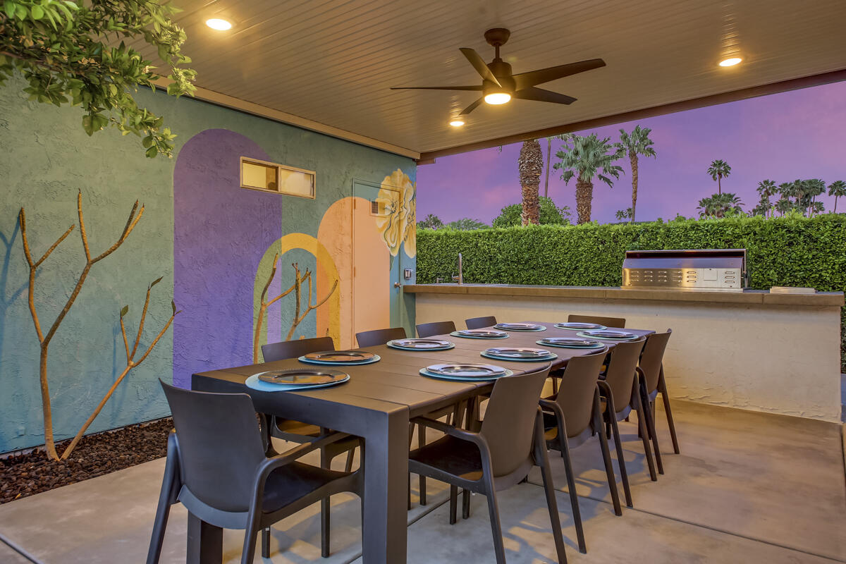 2230 Tamarisk Road Palm Springs, CA 92262 - Photo 5 of 66 a view of a dining room with furniture and a potted plant