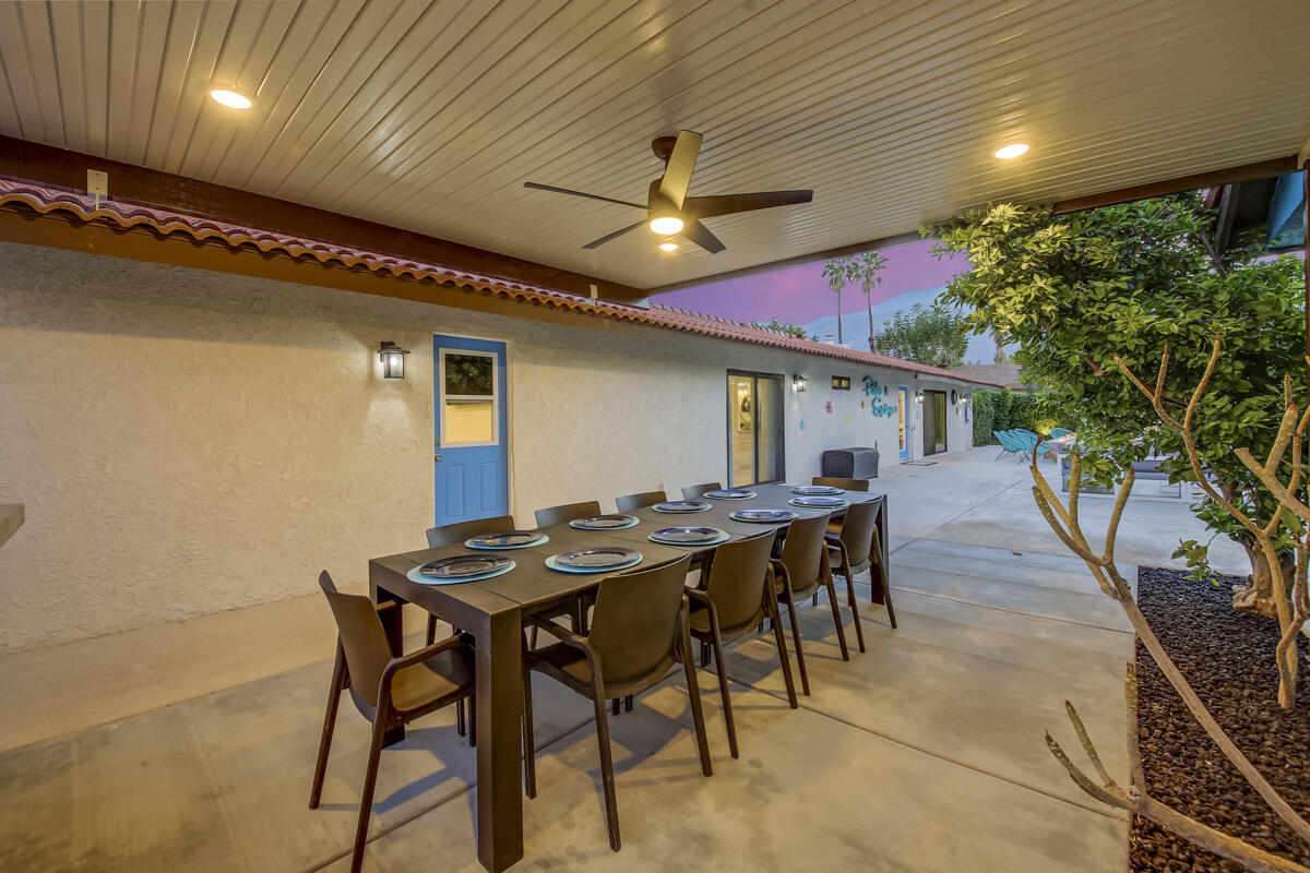 2230 Tamarisk Road Palm Springs, CA 92262 - Photo 6 of 66 a dinning table and chairs in patio of a house