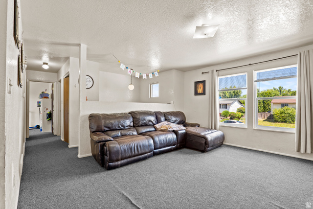 2327 880 North Provo, UT 84601 - Photo 4 of 15 Spacious interior with neutral wall paint and gray carpet flooring