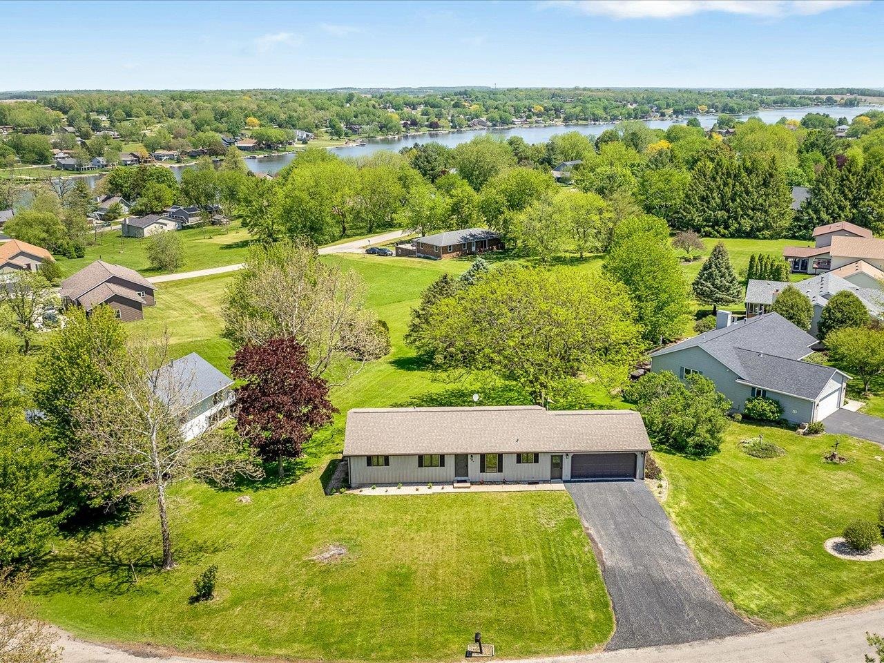 136 Lake Summerset Road Lake Summerset, IL 61019 - Photo 42 of 47 an aerial view of residential houses with outdoor space and swimming pool