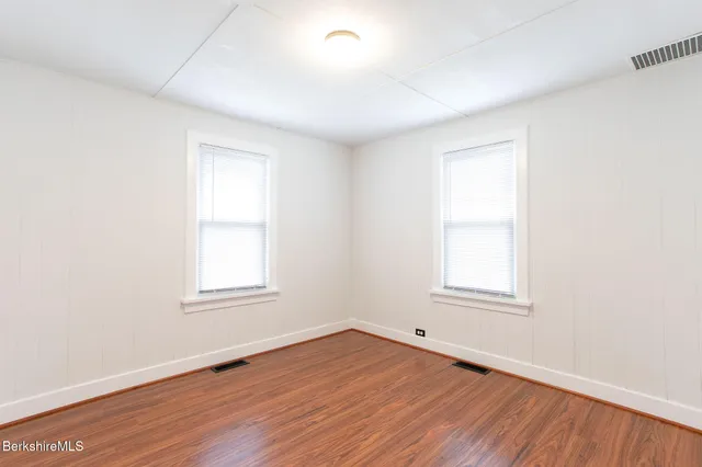 a bathroom with a bathtub and a toilet
