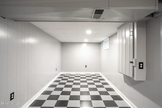 a view of a big room with a black and white checkered floor
