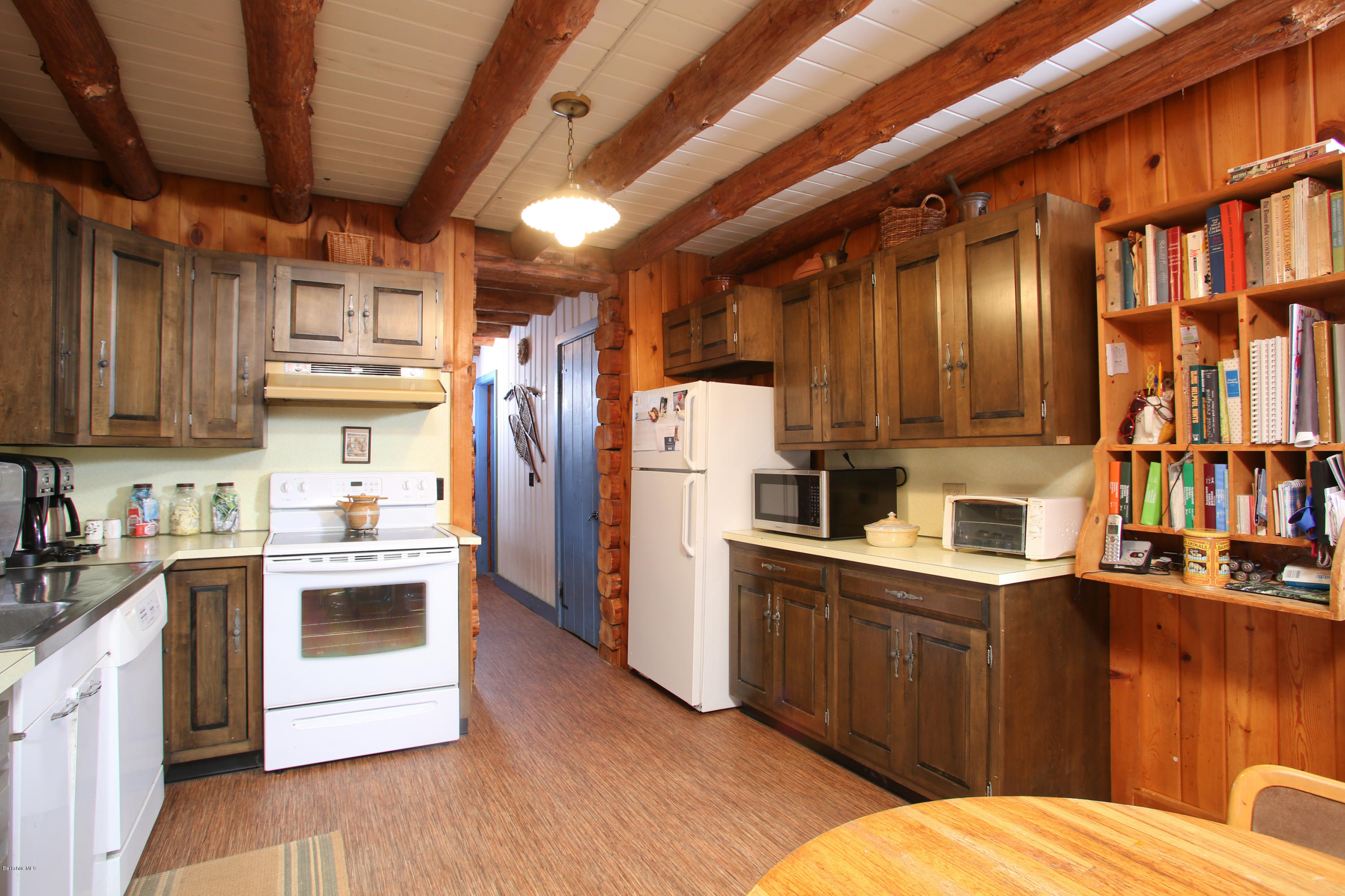 70 Brett Road Monterey, MA 01245 - Photo 8 of 16 a kitchen with stainless steel appliances kitchen island granite countertop a refrigerator and a stove top oven