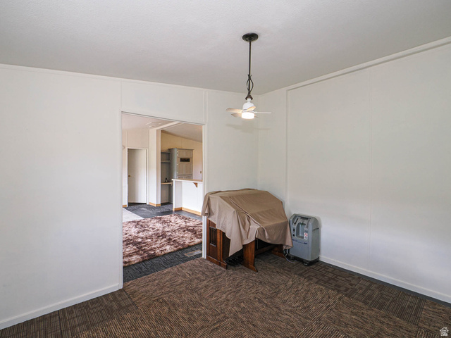 94 Spring Canyon Road Coalville, UT 84017 - Photo 33 of 50 Room featuring neutral wall paneling and textured carpet
