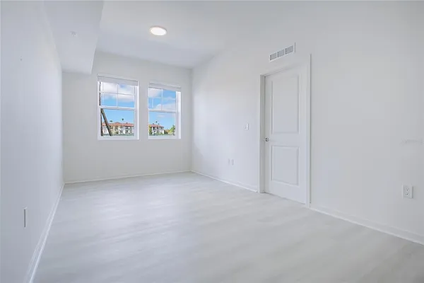 an empty room with windows