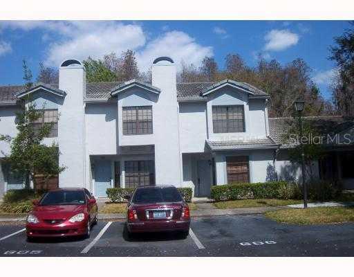 5100 Burchette Road, Unit 606 Tampa, FL 33647 - Photo 1 of 1 a front view of a house with a garden