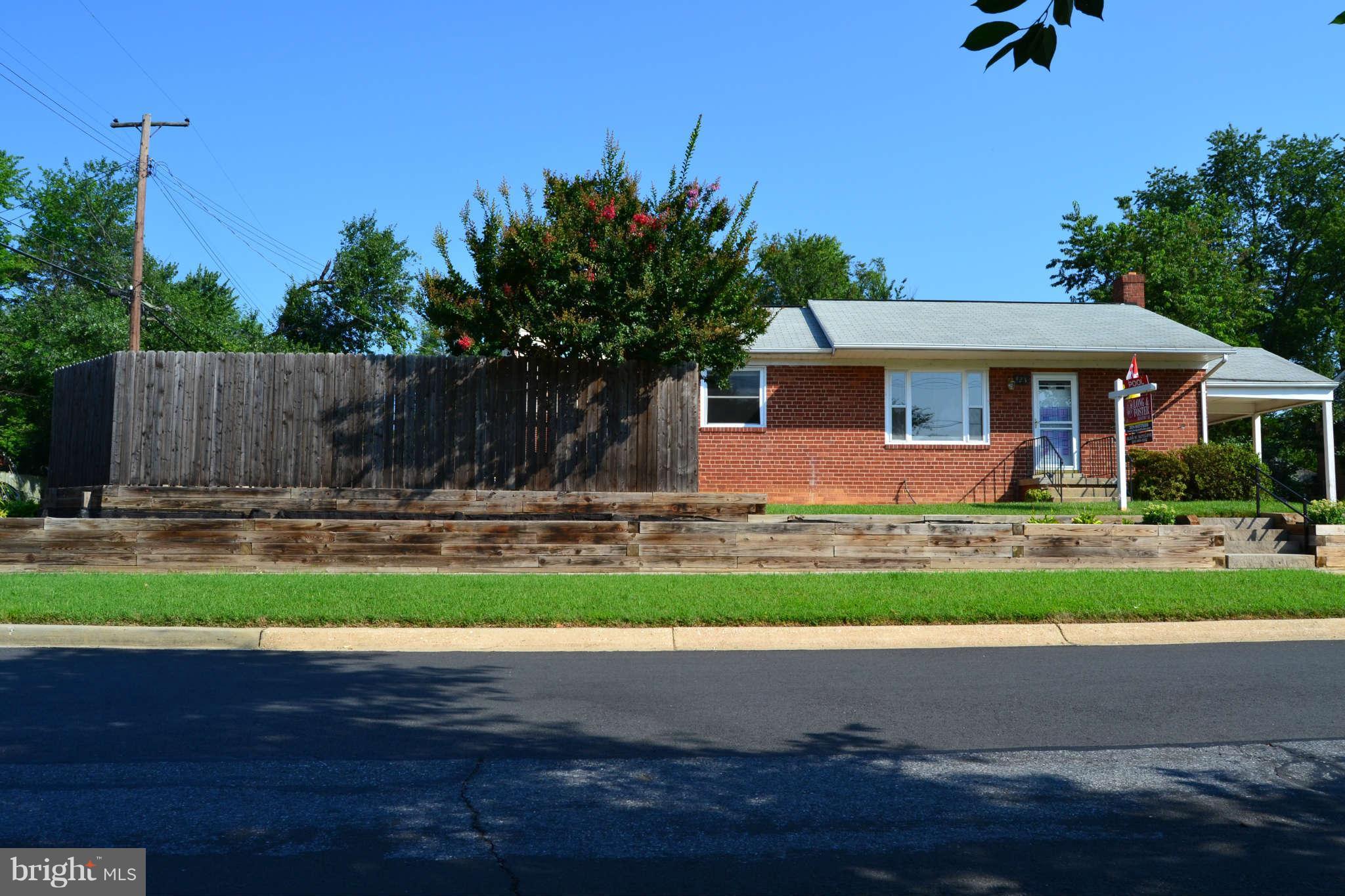 423 Belton Road Silver Spring, MD 20901 - Photo 2 of 28 a front view of a house with a yard
