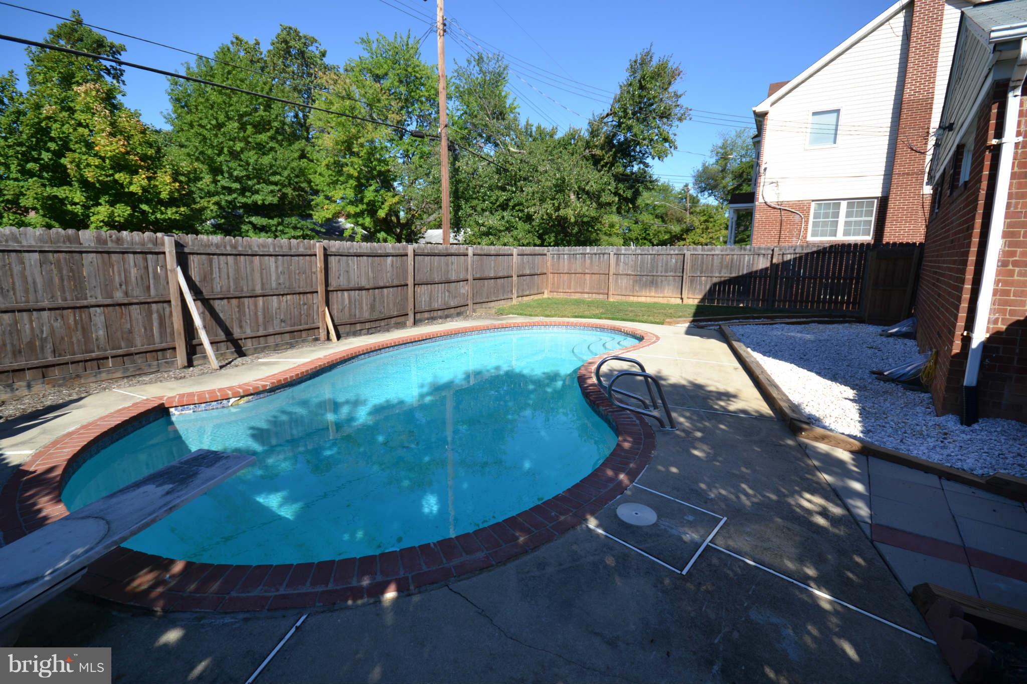 423 Belton Road Silver Spring, MD 20901 - Photo 12 of 28 a view of a swimming pool with a sitting space