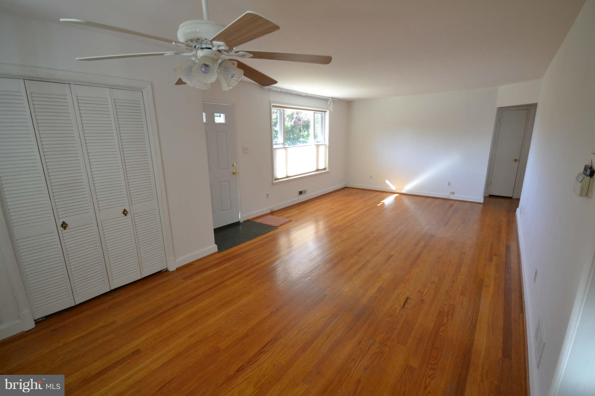 423 Belton Road Silver Spring, MD 20901 - Photo 14 of 28 wooden floor in an empty room with a window