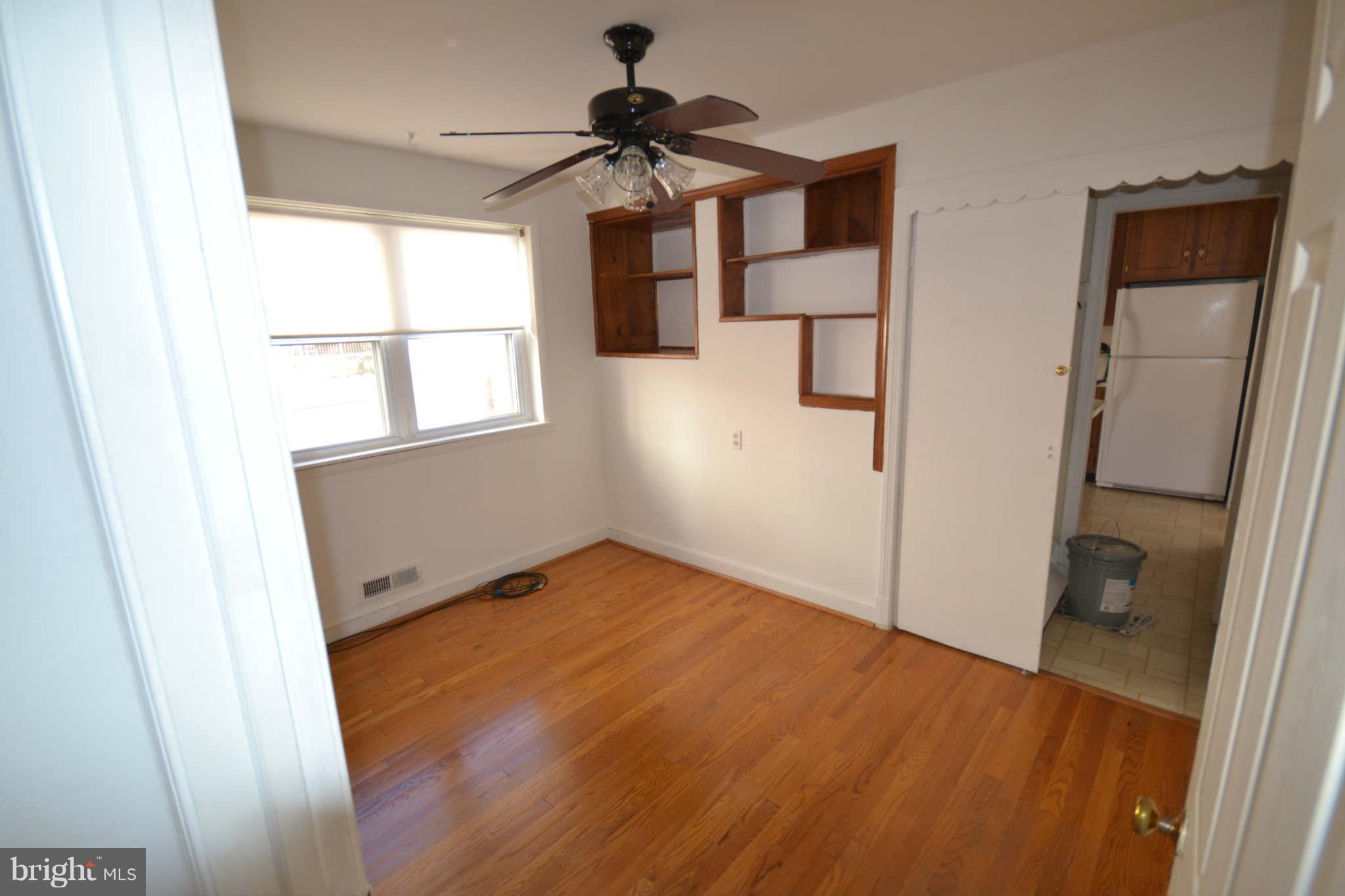 423 Belton Road Silver Spring, MD 20901 - Photo 18 of 28 wooden floor in an empty room with a window