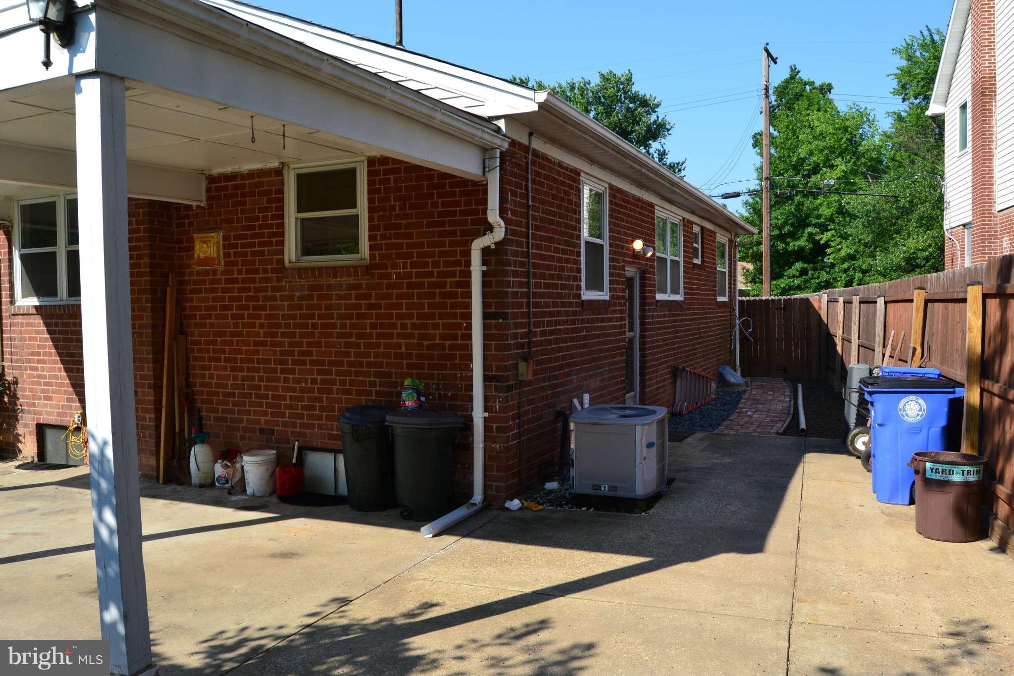 423 Belton Road Silver Spring, MD 20901 - Photo 3 of 28 a view of a patio with couches chairs and potted plants