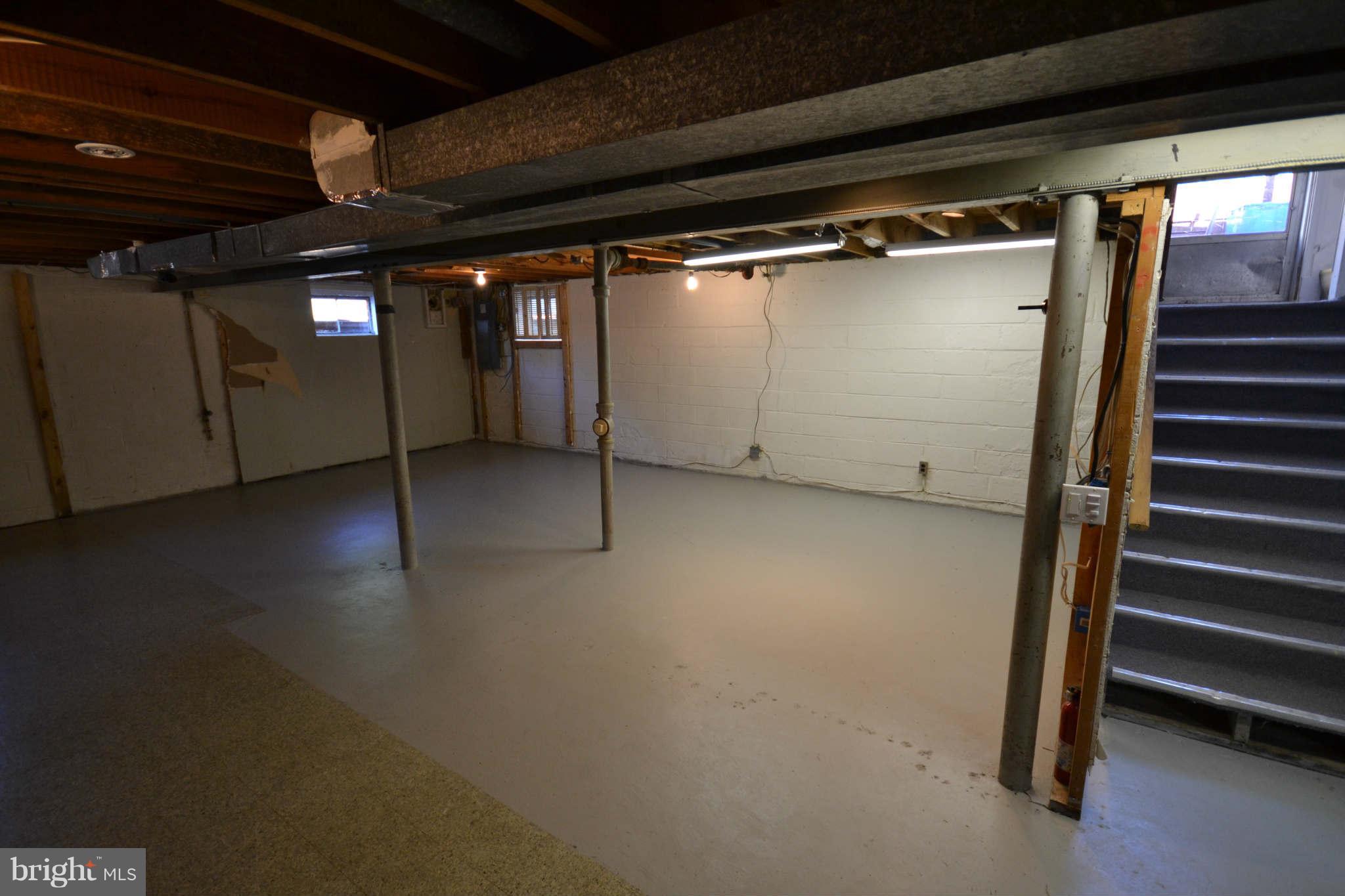 423 Belton Road Silver Spring, MD 20901 - Photo 23 of 28 a view of an empty room with wooden floor and windows