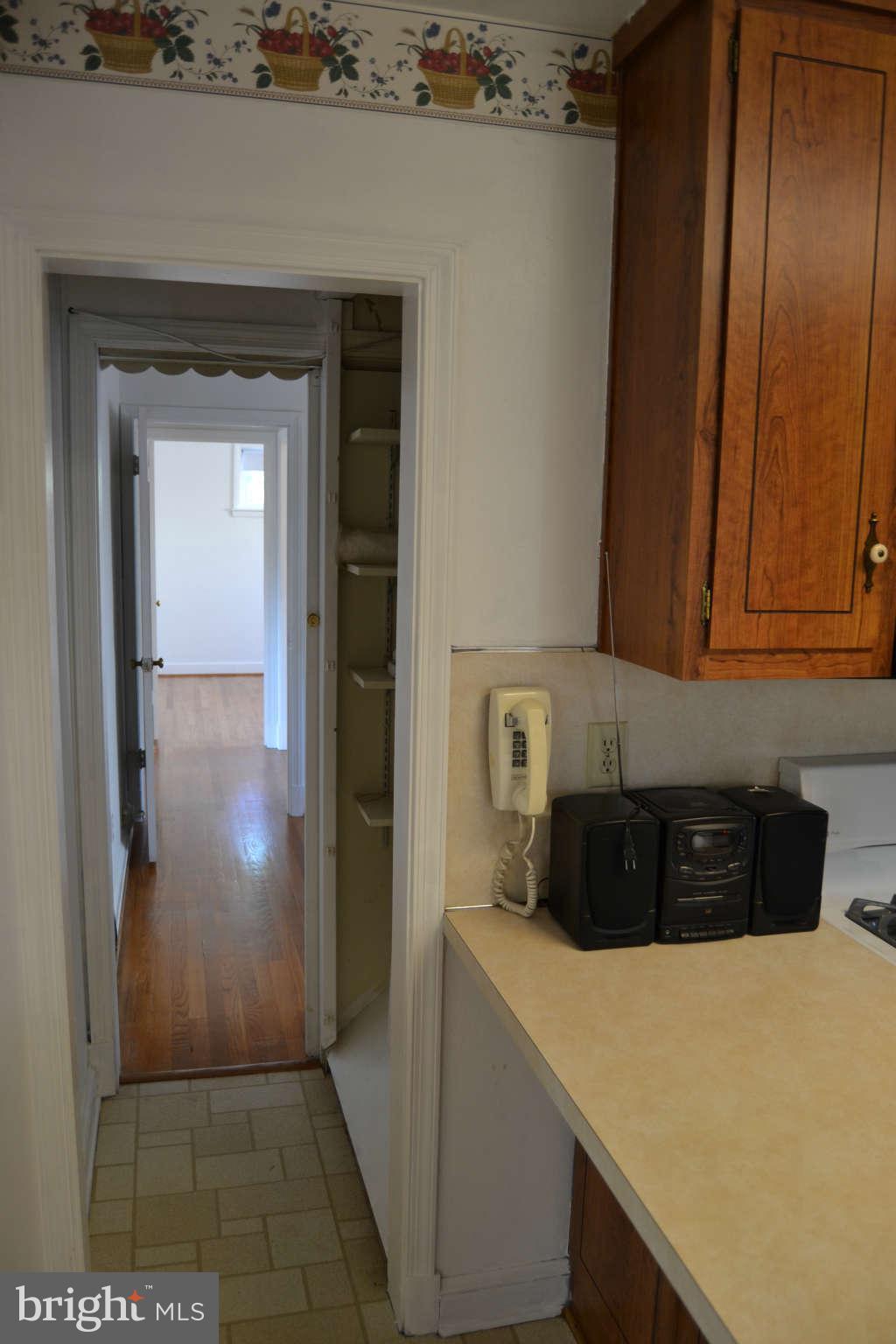 423 Belton Road Silver Spring, MD 20901 - Photo 5 of 28 a kitchen with a refrigerator and cabinets