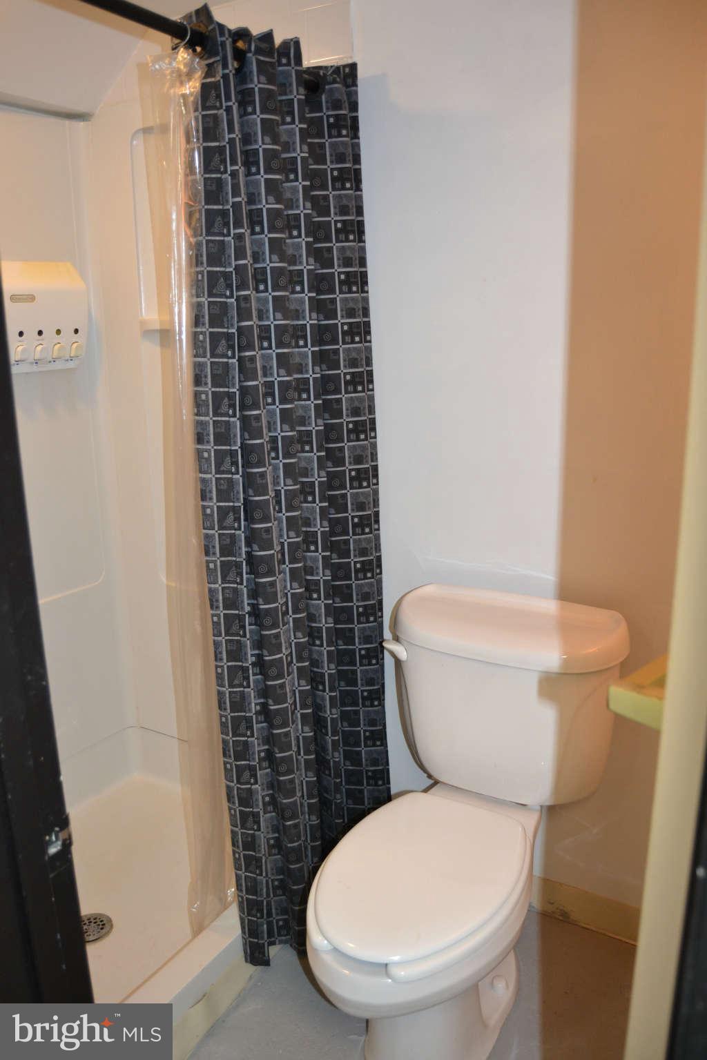 423 Belton Road Silver Spring, MD 20901 - Photo 7 of 28 a white toilet sitting next to a bathroom sink