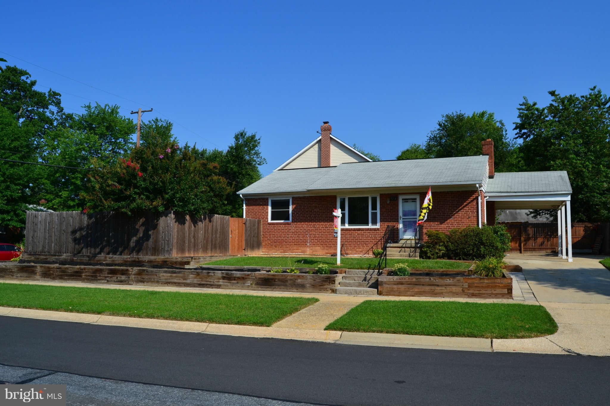 423 Belton Road Silver Spring, MD 20901 - Photo 8 of 28 a front view of a house with a yard