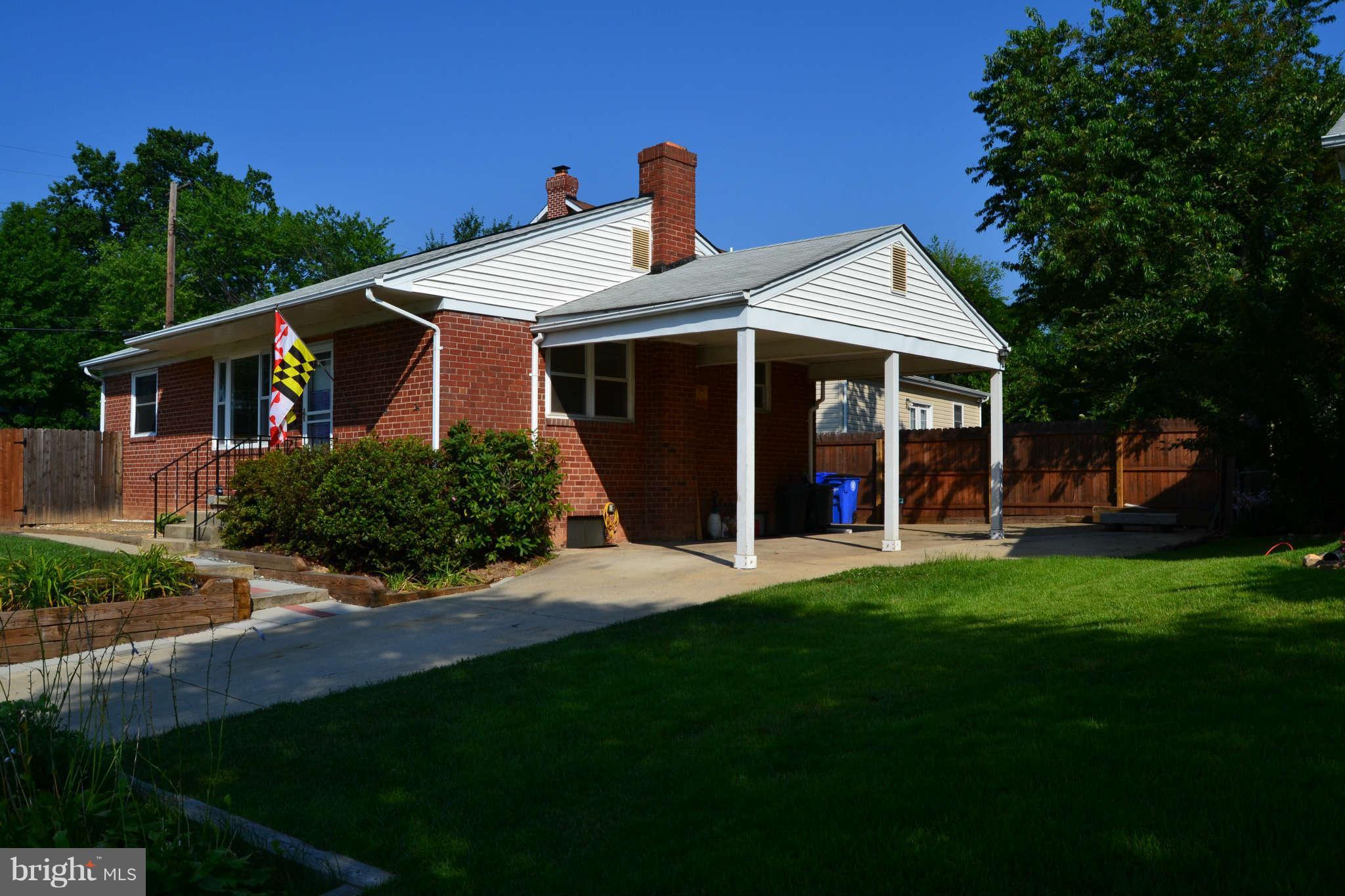 423 Belton Road Silver Spring, MD 20901 - Photo 9 of 28 a front view of a house with a garden