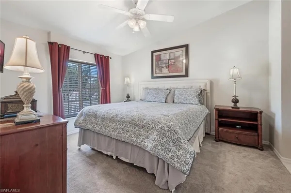 a bedroom with a bed dresser and a window