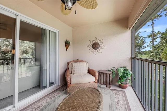 a bedroom with a bed and a potted plant