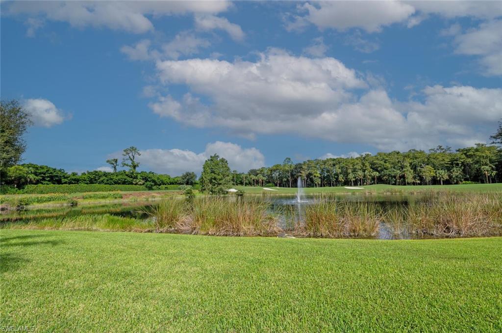2895 Cypress Trace Circle, Unit 202 Naples, FL 34119 - Photo 27 of 30 a view of a lake