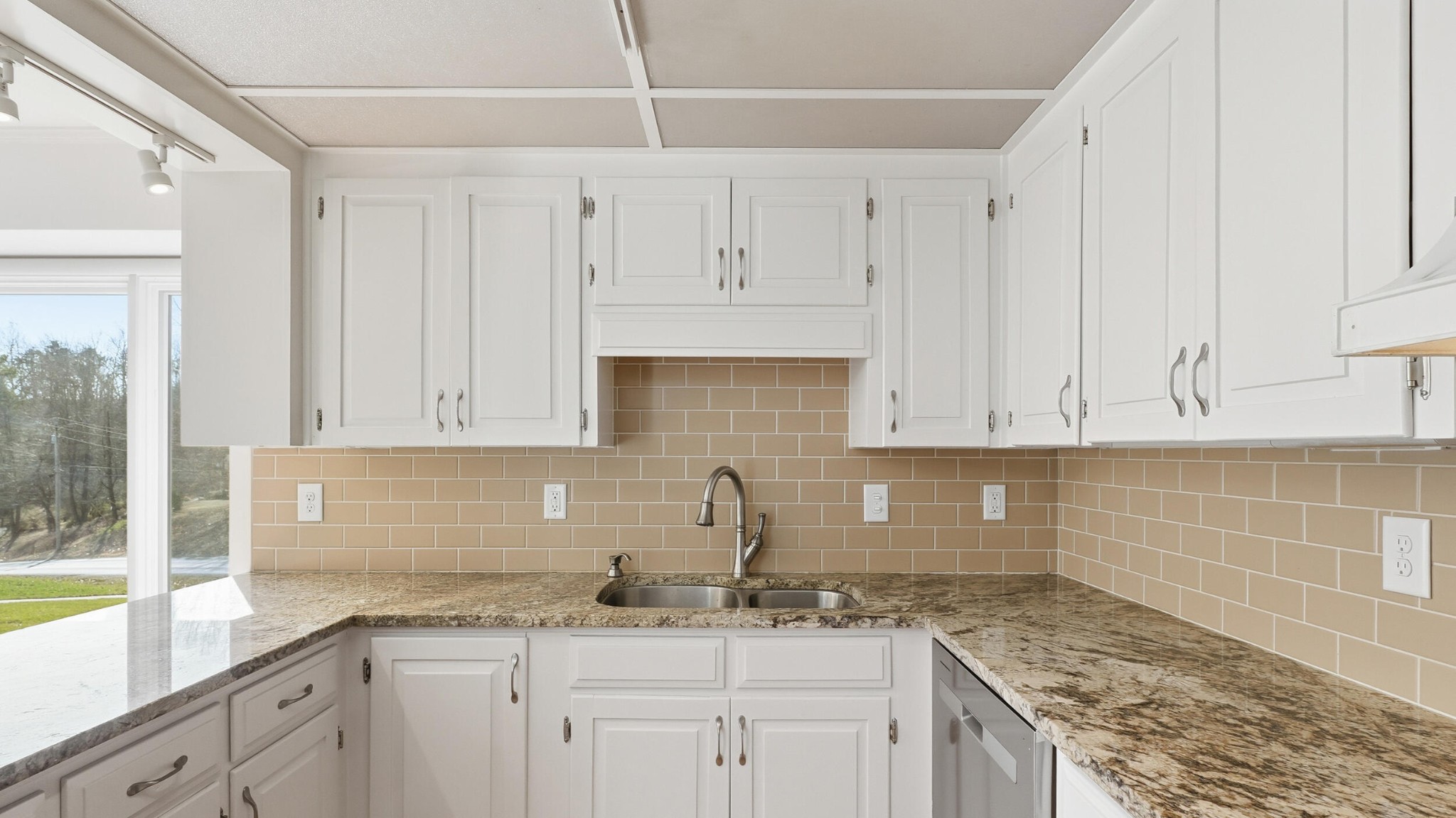 755 Golf View Drive Northwest Cleveland, TN 37312 - Photo 15 of 49 a kitchen with granite countertop white cabinets and a sink