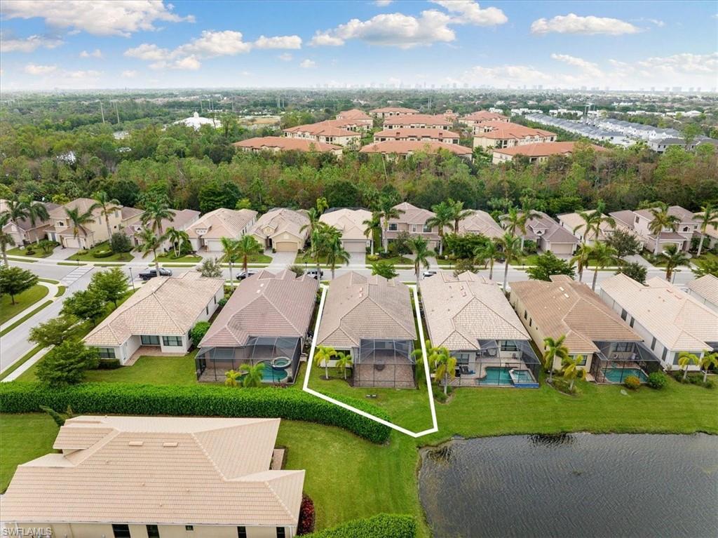 1509 Serrano Circle Naples, FL 34105 - Photo 20 of 24 an aerial view of a house with a garden