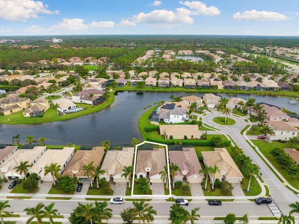 1509 Serrano Circle Naples, FL 34105 - Photo 22 of 24 an aerial view of residential houses with outdoor space and ocean view