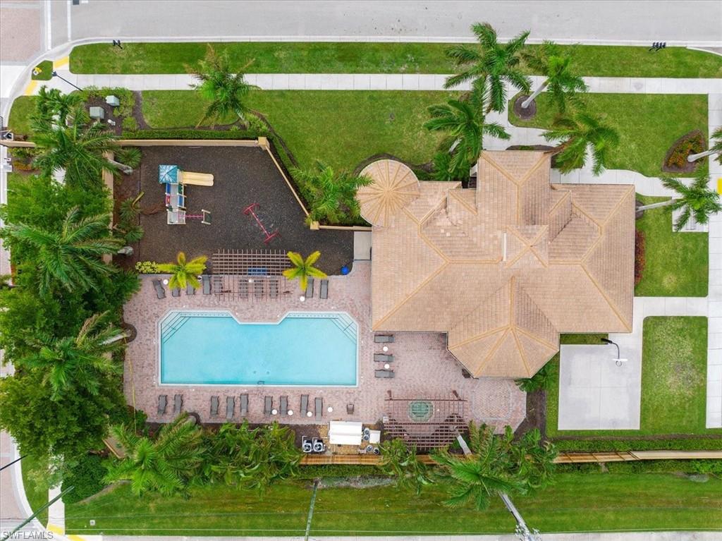 1509 Serrano Circle Naples, FL 34105 - Photo 23 of 24 an aerial view of a house with a garden and lake view