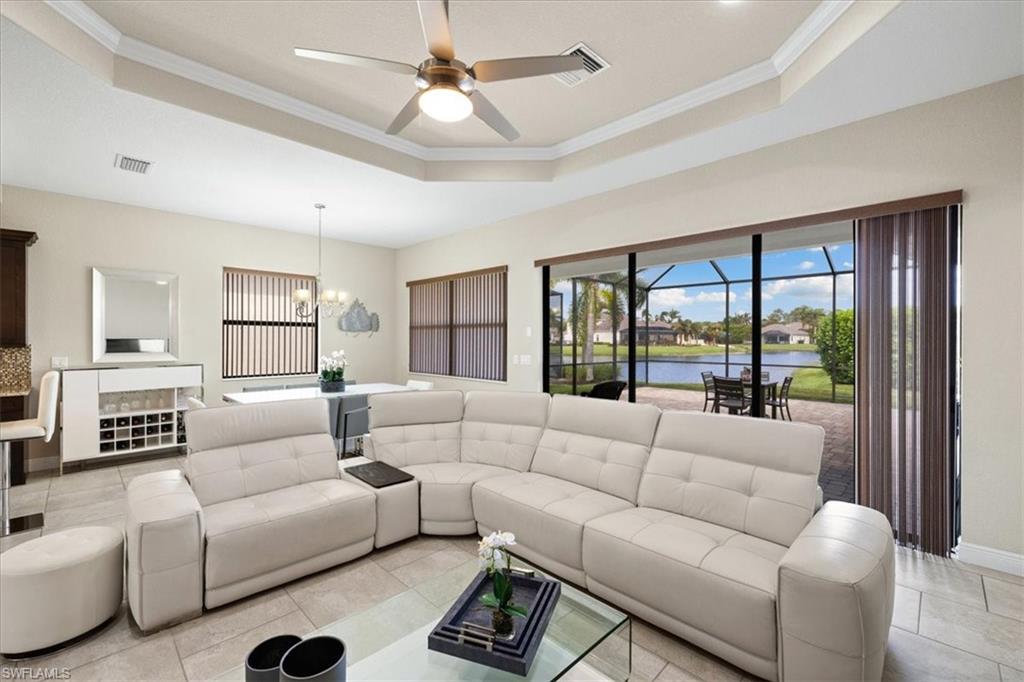 1509 Serrano Circle Naples, FL 34105 - Photo 8 of 24 a living room with furniture and a large window