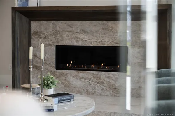 a kitchen with a stove and white cabinets