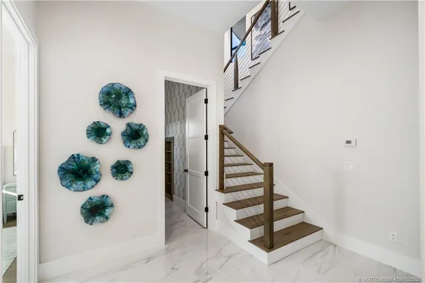 a view of a chandelier fan and a rug