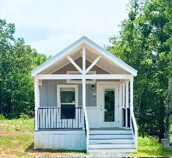 a front view of a house with a porch