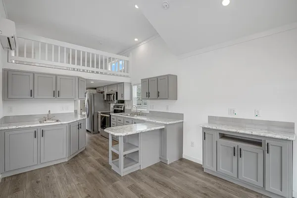 a kitchen with a sink and cabinets