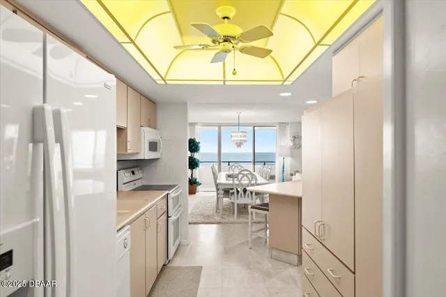 a kitchen with stainless steel appliances kitchen island sink stove and refrigerator