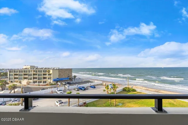 a bedroom with double bed and a potted plant