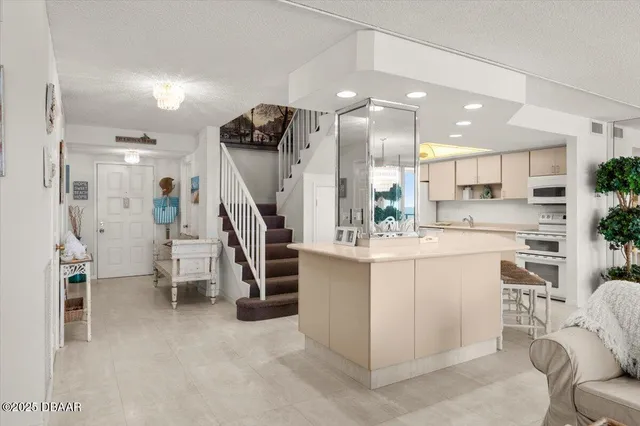 a en suite bathroom with a granite countertop sink and a mirror