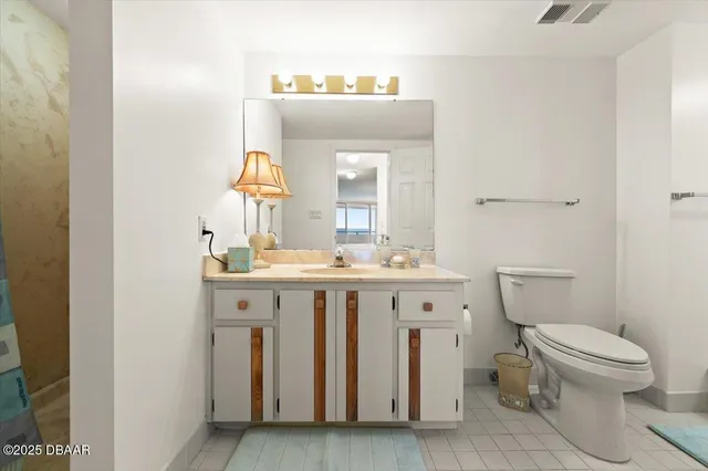 a spacious bathroom with a double vanity sink a mirror and shower