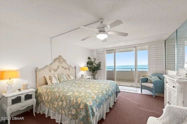 a view of a patio with lawn chairs microwave and stove