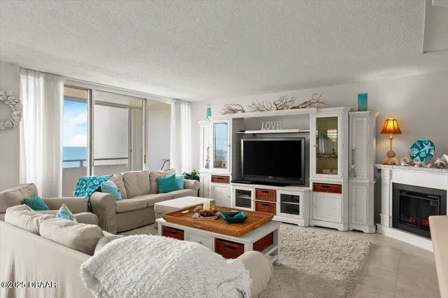 a very nice looking room with a large window and chandelier