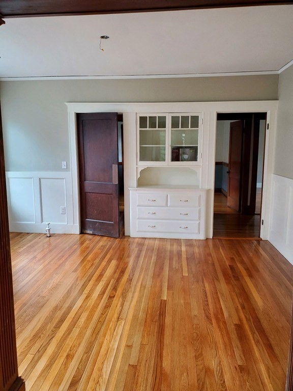 22 Allen Street, Unit 2 Arlington, MA 02474 - Photo 7 of 25 a view of an empty room with wooden floor and a window