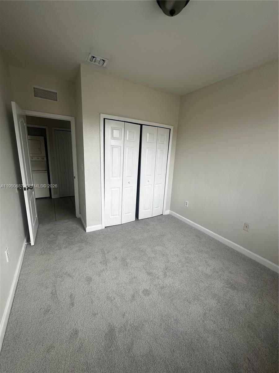 2903 Southeast 17th Avenue, Unit 209 Homestead, FL 33035 - Photo 24 of 30 a view of an empty room and closet area