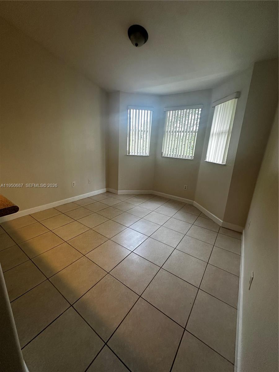 2903 Southeast 17th Avenue, Unit 209 Homestead, FL 33035 - Photo 26 of 30 an empty room with windows
