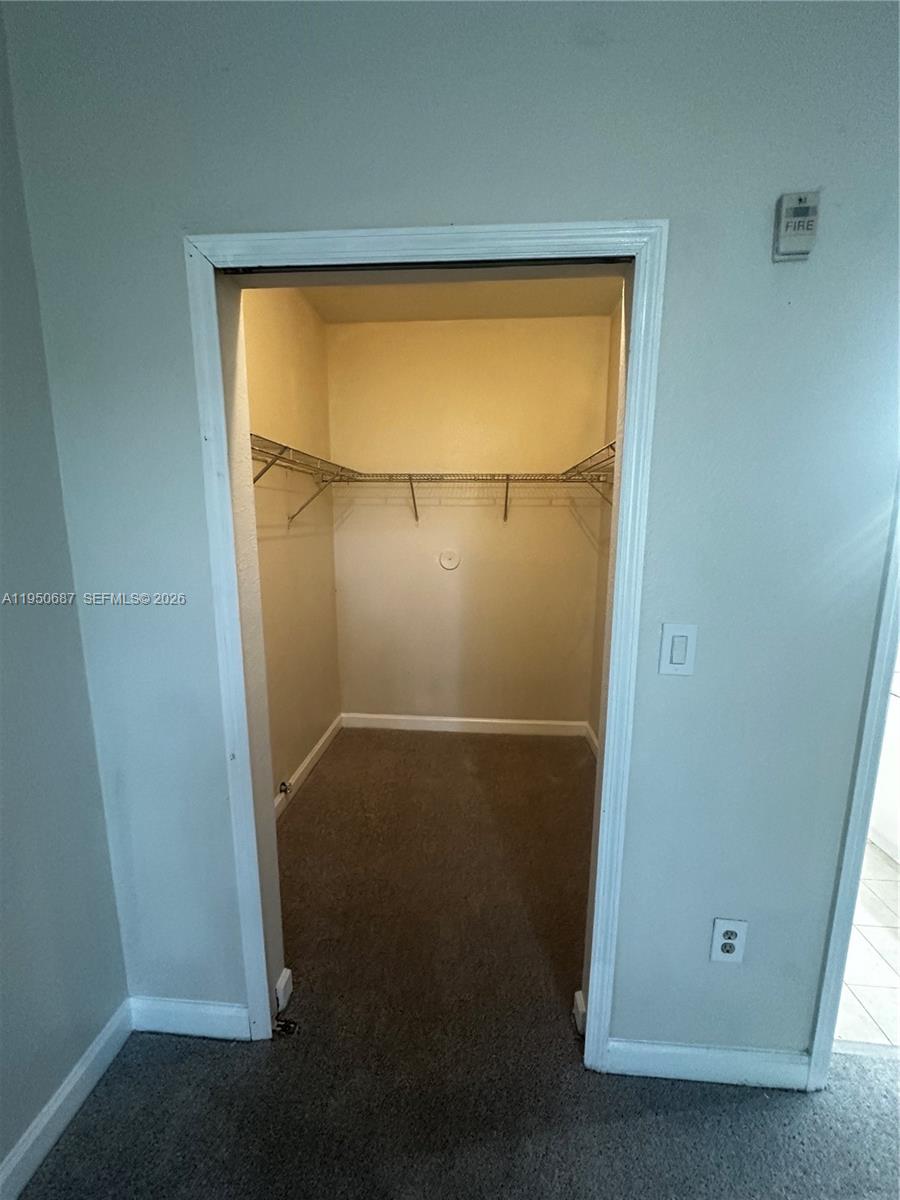 2903 Southeast 17th Avenue, Unit 209 Homestead, FL 33035 - Photo 29 of 30 a bathroom with a glass shower door
