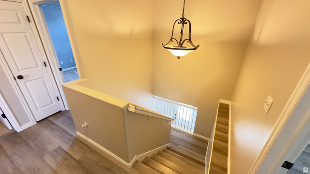 3547 East Golden Eagle Road Eagle Mountain, UT 84005 - Photo 14 of 47 Stairway featuring wood finished floors and baseboards