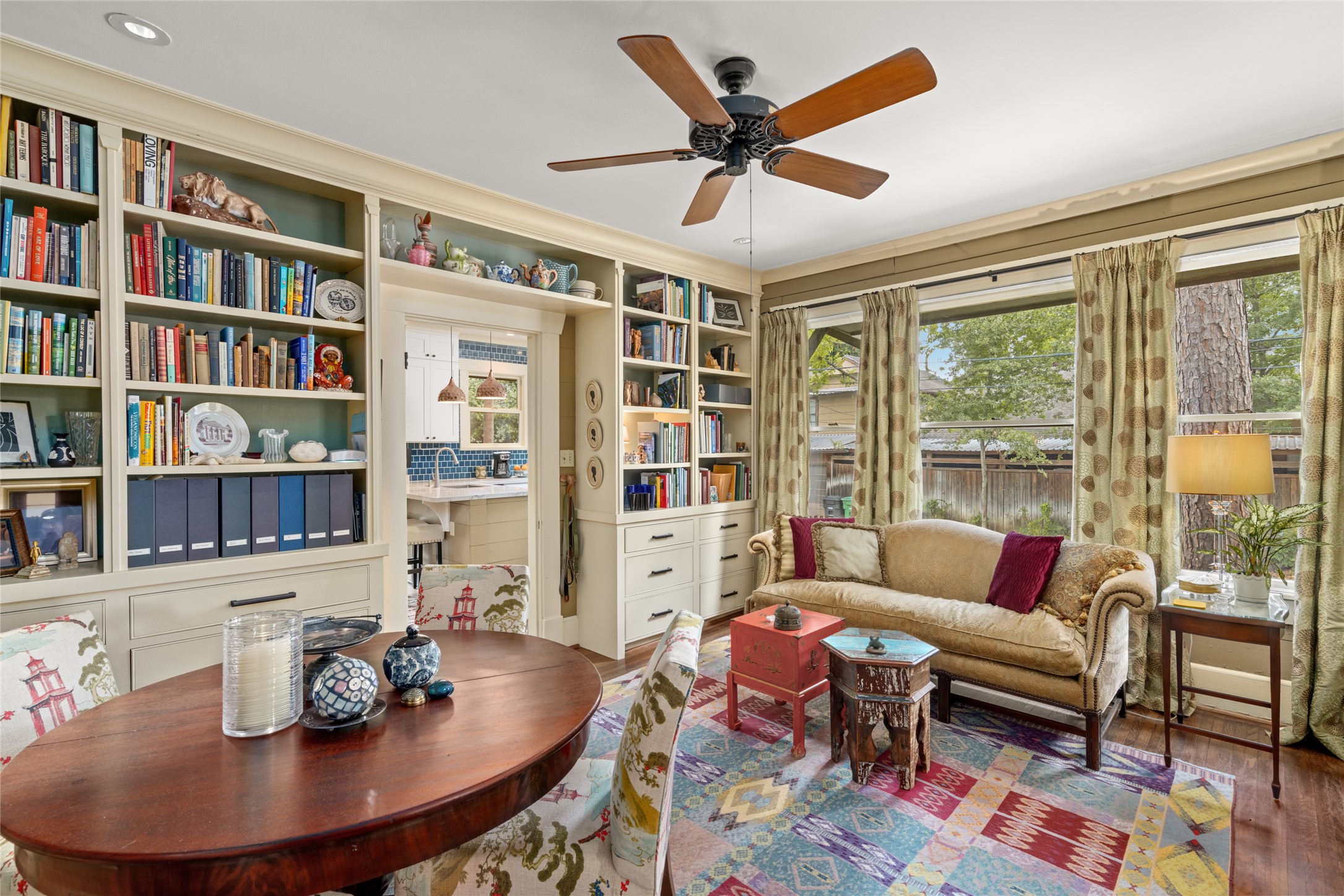 4502 Stanford Street Houston, TX 77006 - Photo 12 of 39 a living room with furniture and a book shelf