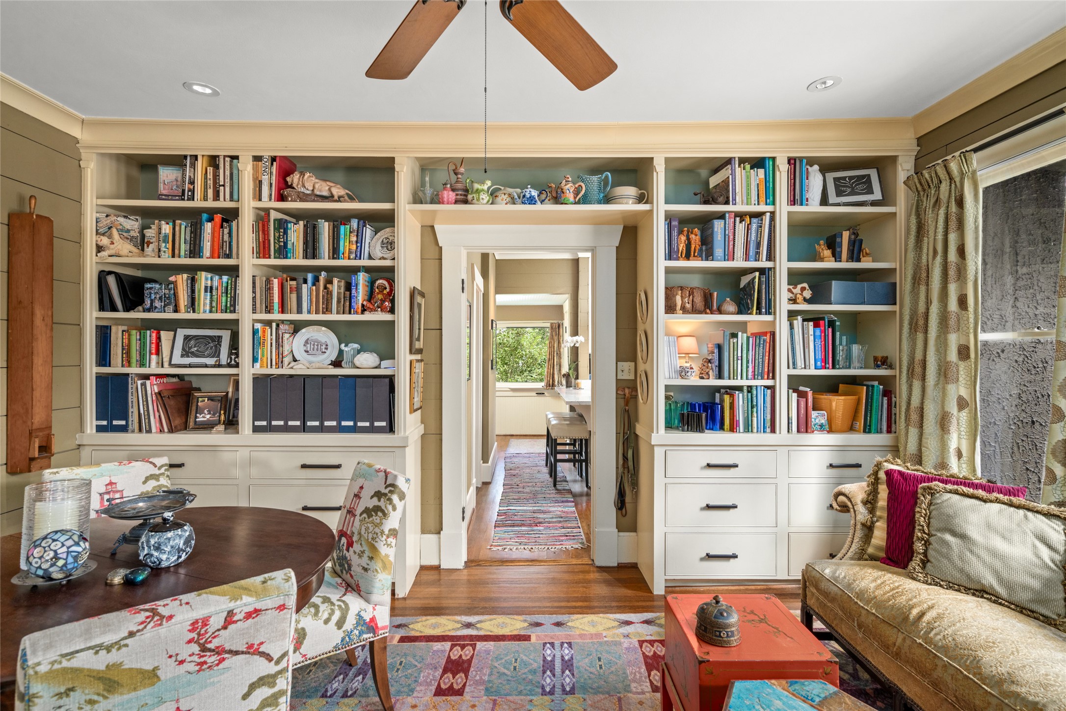 4502 Stanford Street Houston, TX 77006 - Photo 13 of 39 a living room with furniture and a book shelf