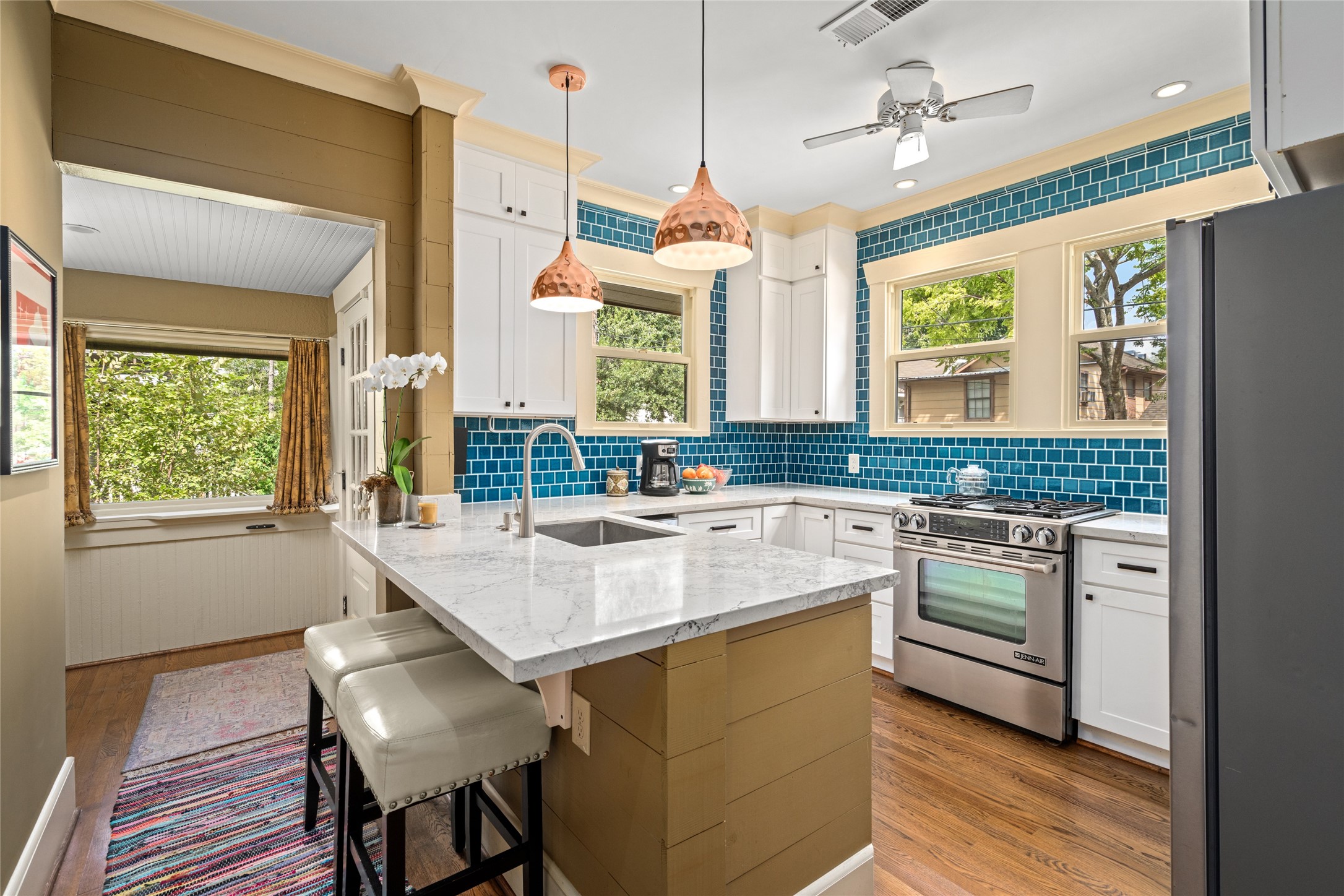 4502 Stanford Street Houston, TX 77006 - Photo 15 of 39 a kitchen with a stove a sink and a refrigerator